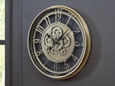 Warmstead Furniture - Ashley Furniture - Gilover Wall Decor - Wall Clock / Champagne Finish - A8010386