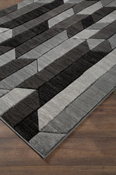 Warmstead Furniture - Ashley Furniture - Chayse Rug - 6'6" x 9'6" Rug / Black/Gray - R403461
