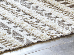Warmstead Furniture - Ashley Furniture - Karalee Rug - 5' x 7' Rug / Ivory/Brown - R404442