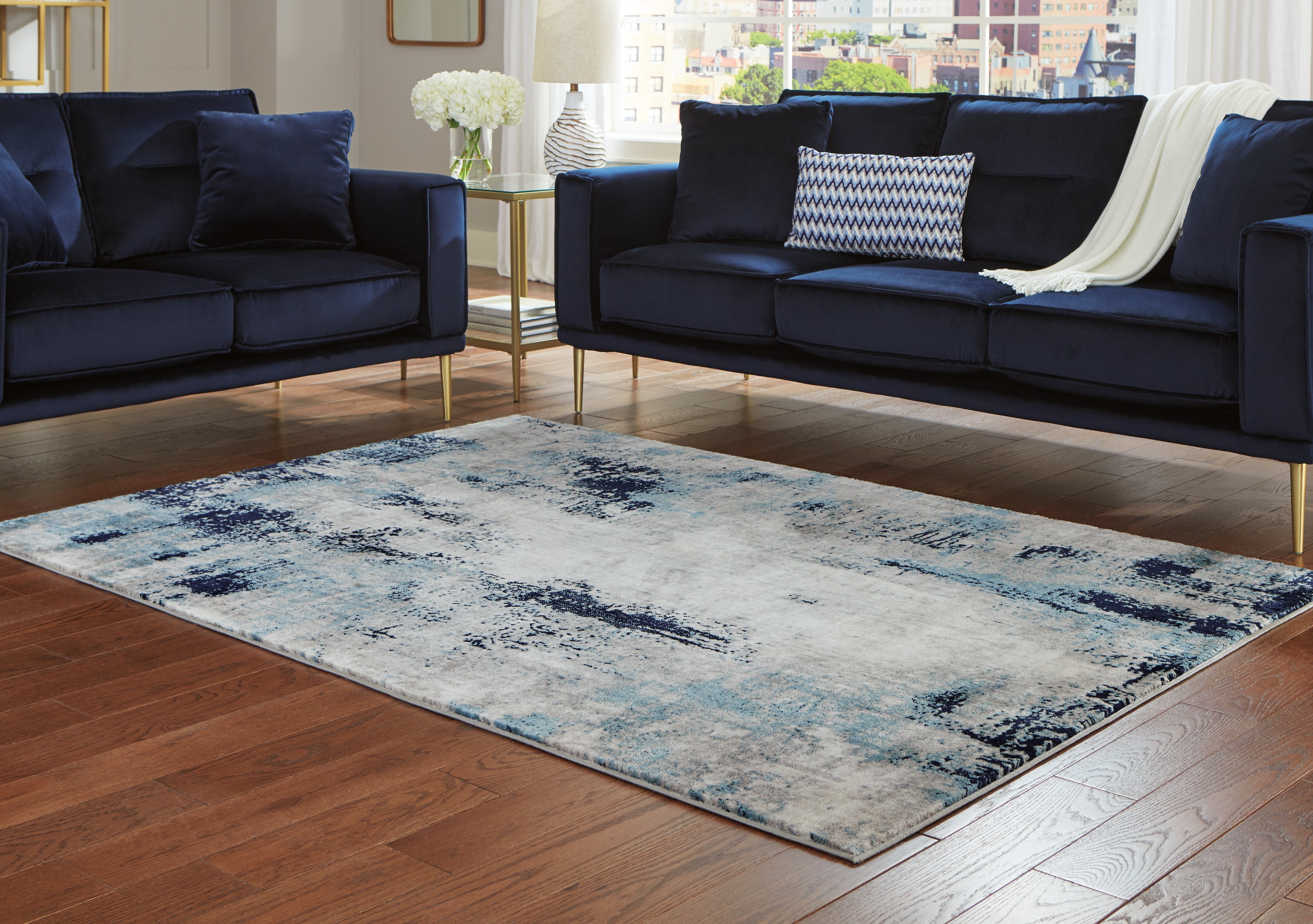 Warmstead Furniture - Ashley Furniture - Leonelle Rug - 5'3" x 7'3" Rug / Cream/Blue/Gray - R404872
