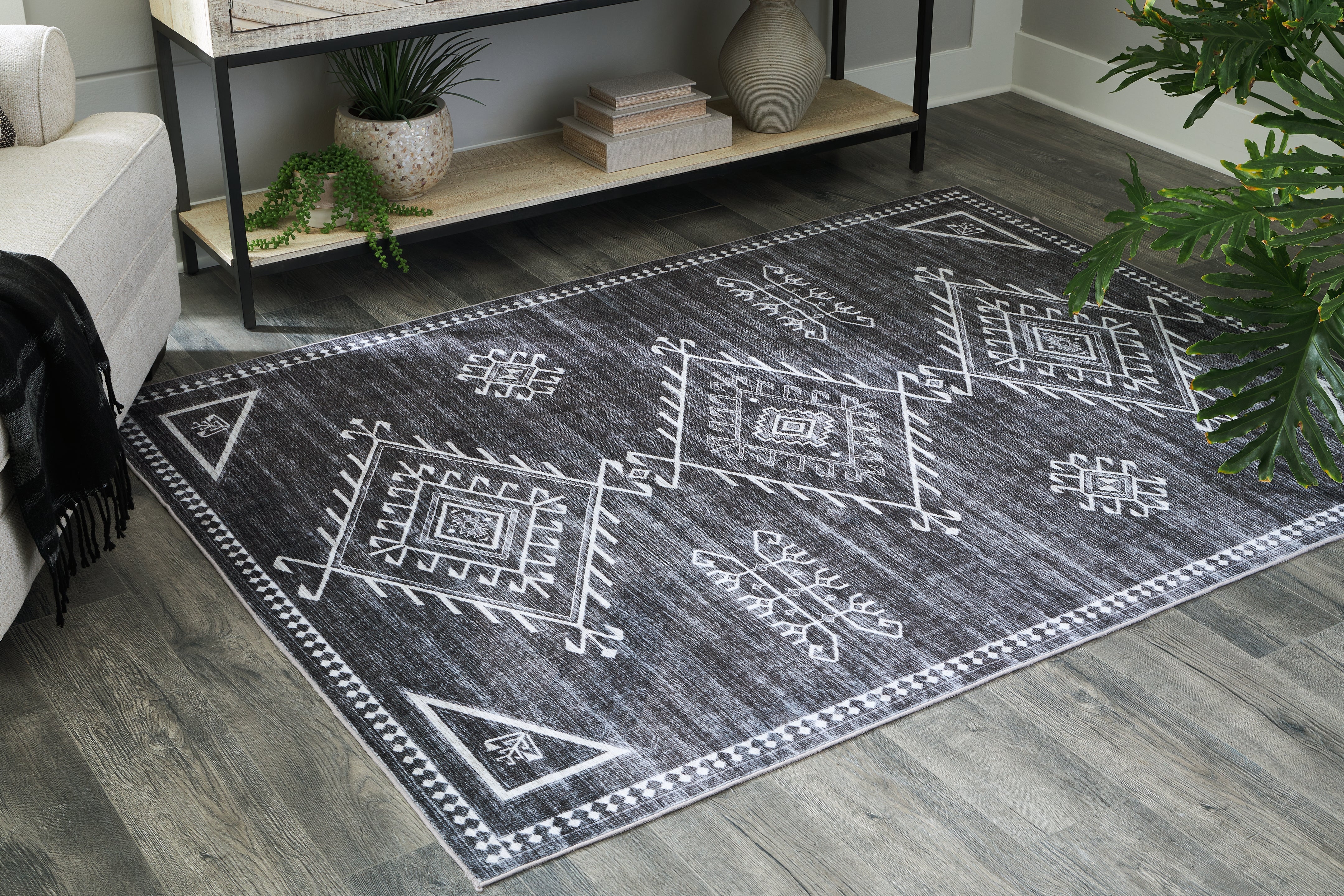 Warmstead Furniture - Ashley Furniture - Arloman Rug - 5' x 7' Washable Rug / Black/Cream/Gray - R405932