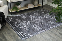 Warmstead Furniture - Ashley Furniture - Arloman Rug - 5' x 7' Washable Rug / Black/Cream/Gray - R405932