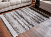 Warmstead Furniture - Ashley Furniture - Henchester Rug - 5' x 7' Washable Rug / Multi - R405992