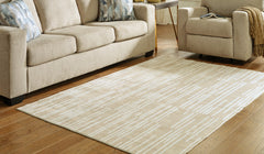 Warmstead Furniture - Ashley Furniture - Ardenville Rug - 5' x 7'1" Washable Rug / Tan/Cream - R406212