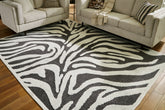 Warmstead Furniture - Ashley Furniture - Thomwith Rug - 8' x 10'2" Washable Rug / Black/Ivory - R406291