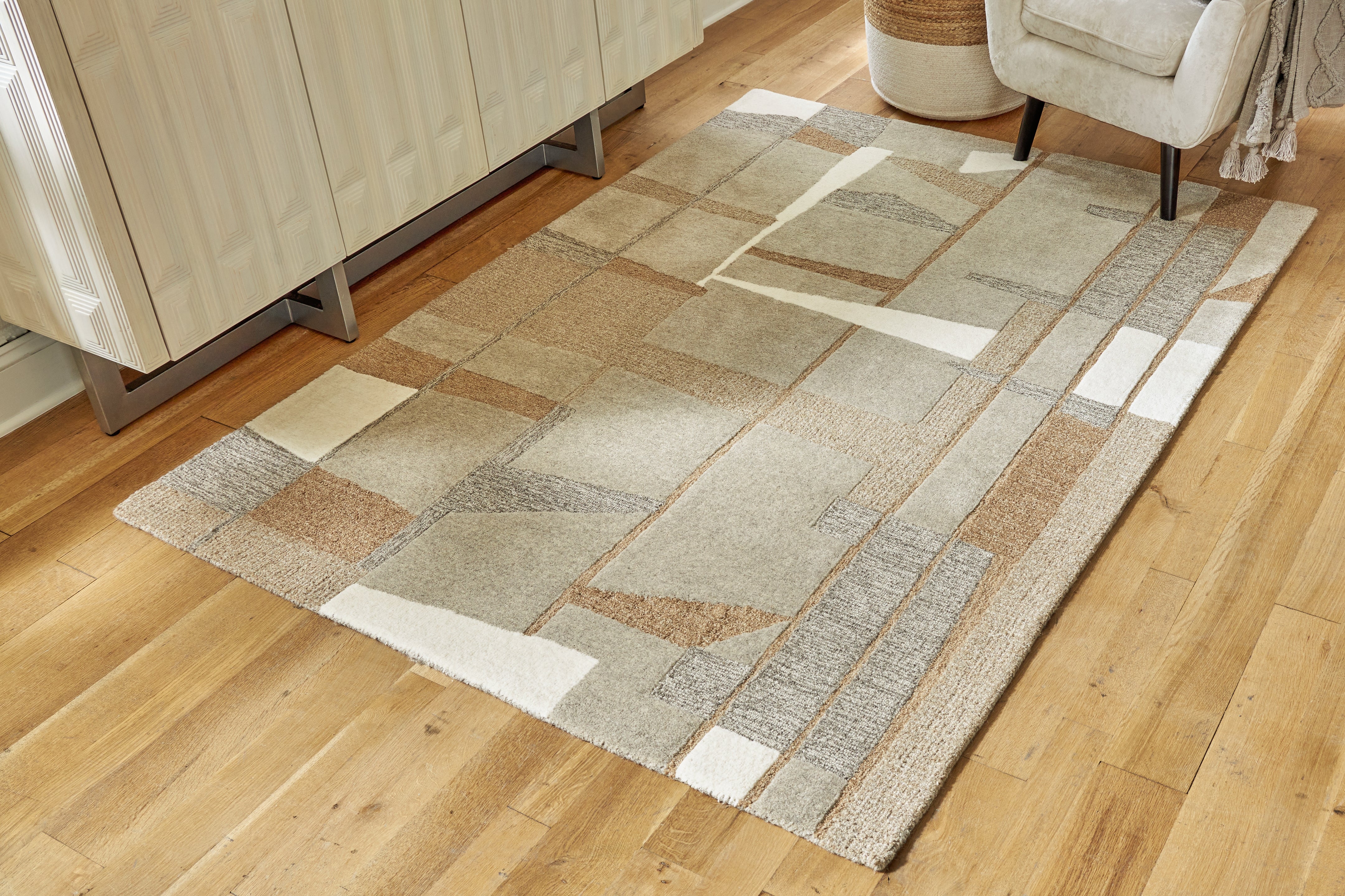 Warmstead Furniture - Ashley Furniture - Abbotton Rug - 5' x 7' Rug / Taupe/Gray/Caramel - R406332