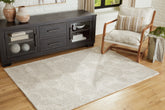 Warmstead Furniture - Ashley Furniture - Chadess Rug - 5' x 7' Rug / Linen/Taupe - R406362