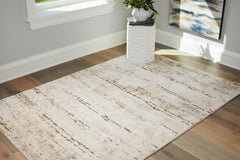 Warmstead Furniture - Ashley Furniture - Kasney Rug - 8' x 10' Rug / Cream/Brown - R406851