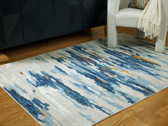 Warmstead Furniture - Ashley Furniture - Vinlett Rug - 5' x 7' Washable Rug / Cream/Blue/Brown - R407042