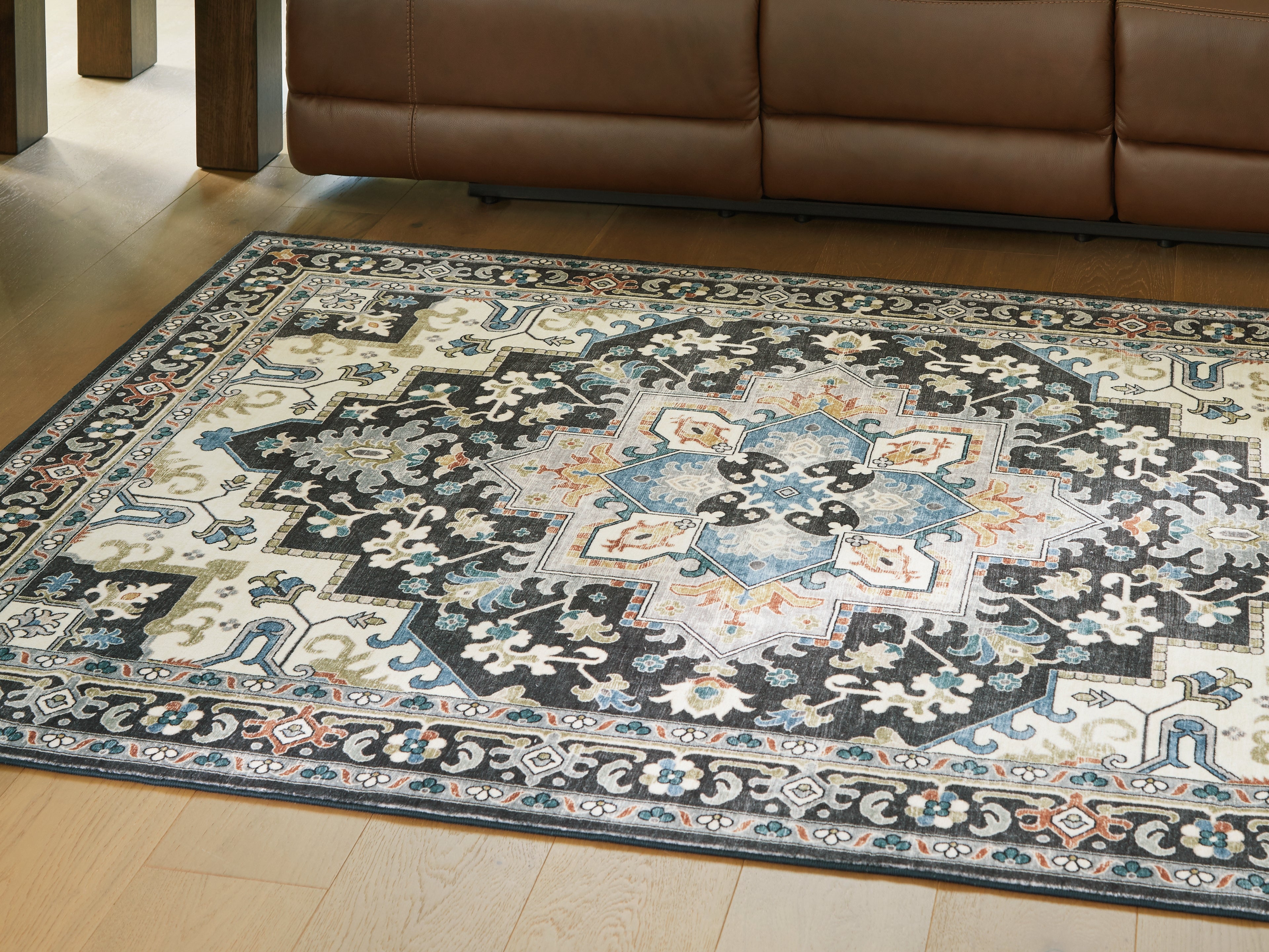 Warmstead Furniture - Ashley Furniture - Leningston Rug - 5' x 7' Washable Rug / Black/Cream/Blue - R407062