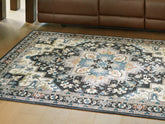 Warmstead Furniture - Ashley Furniture - Leningston Rug - 5' x 7' Washable Rug / Black/Cream/Blue - R407062