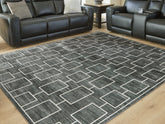Warmstead Furniture - Ashley Furniture - Elderland Rug - Washable 5' x 7' Area Rug / Black/Gray - R407402