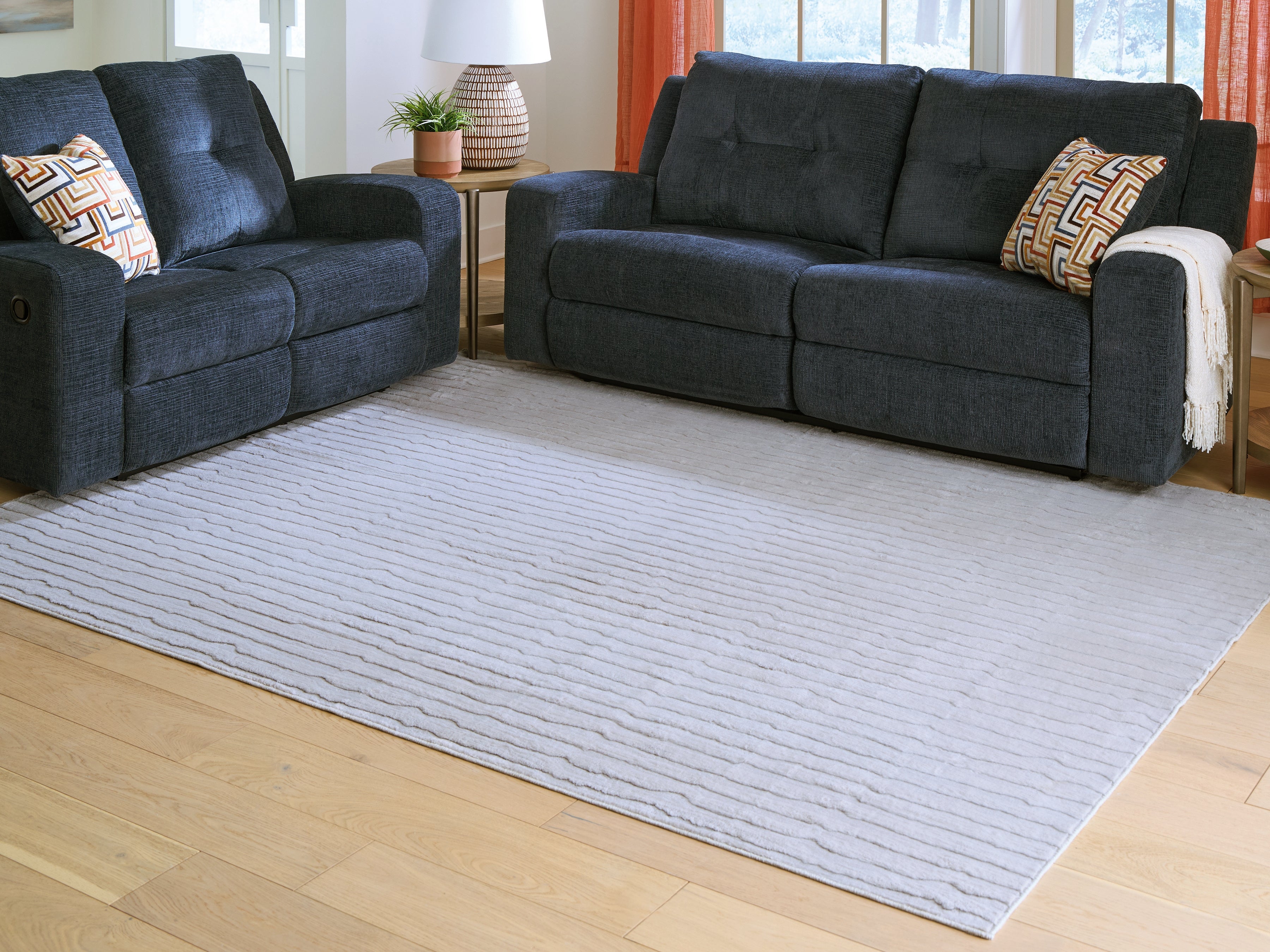 Warmstead Furniture - Ashley Furniture - Worthley Rug - Washable 5' x 7' Area Rug / Gray - R407452