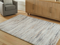 Warmstead Furniture - Ashley Furniture - Nace Rug - 7'6" x 9'6" Area Rug / Gray/Brown/White - R407471