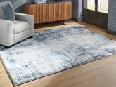 Warmstead Furniture - Ashley Furniture - Arlenmont Rug - 5' x 7' Area Rug / Blue/White/Brown - R407482