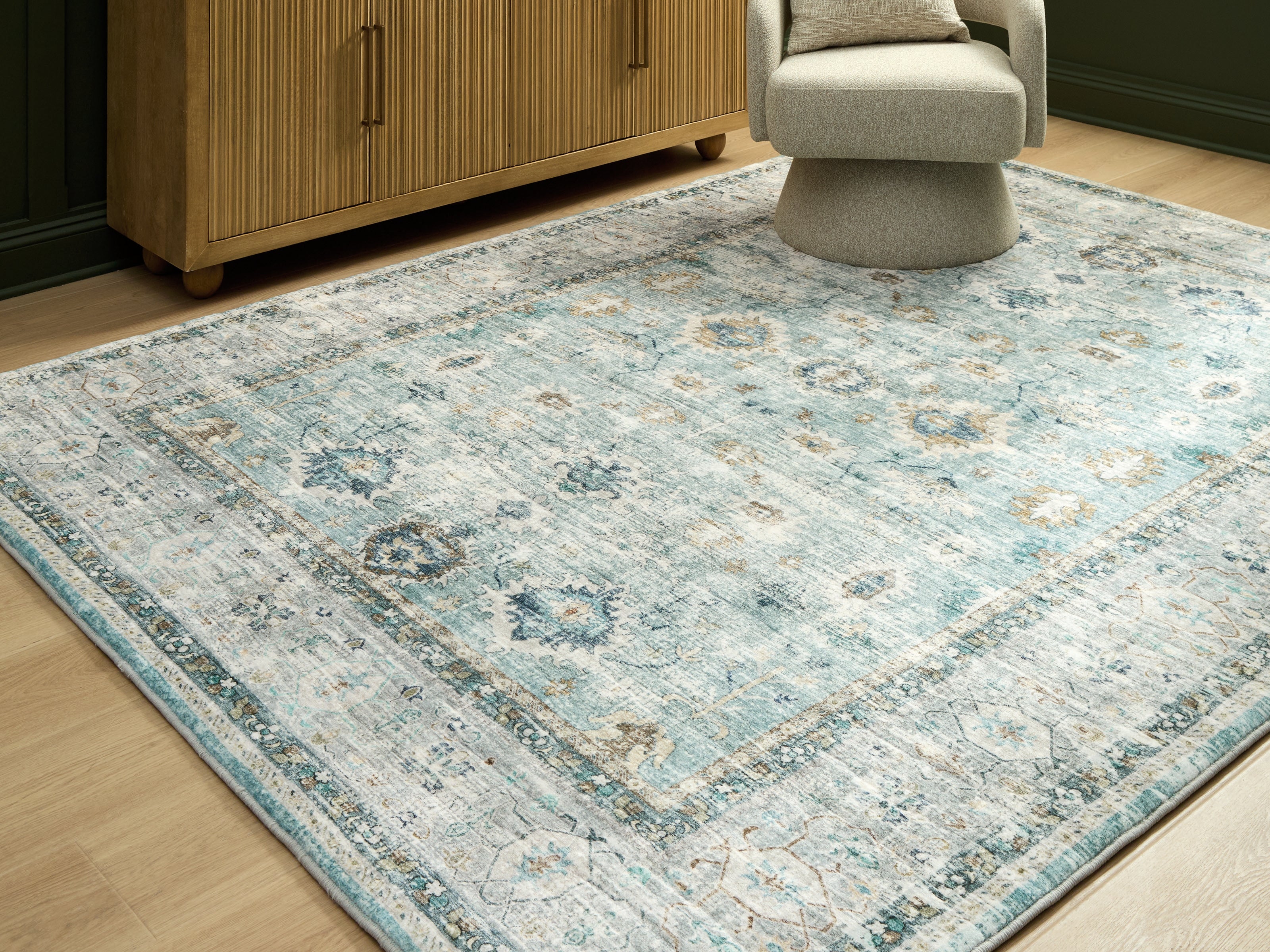 Warmstead Furniture - Ashley Furniture - Ladstoney Rug - 5' x 7' Area Rug / Teal/Beige/Ochre - R407502