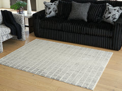 Warmstead Furniture - Ashley Furniture - Turinwith Rug - 5'3" x 7' Area Rug / Ivory/Black - R407552