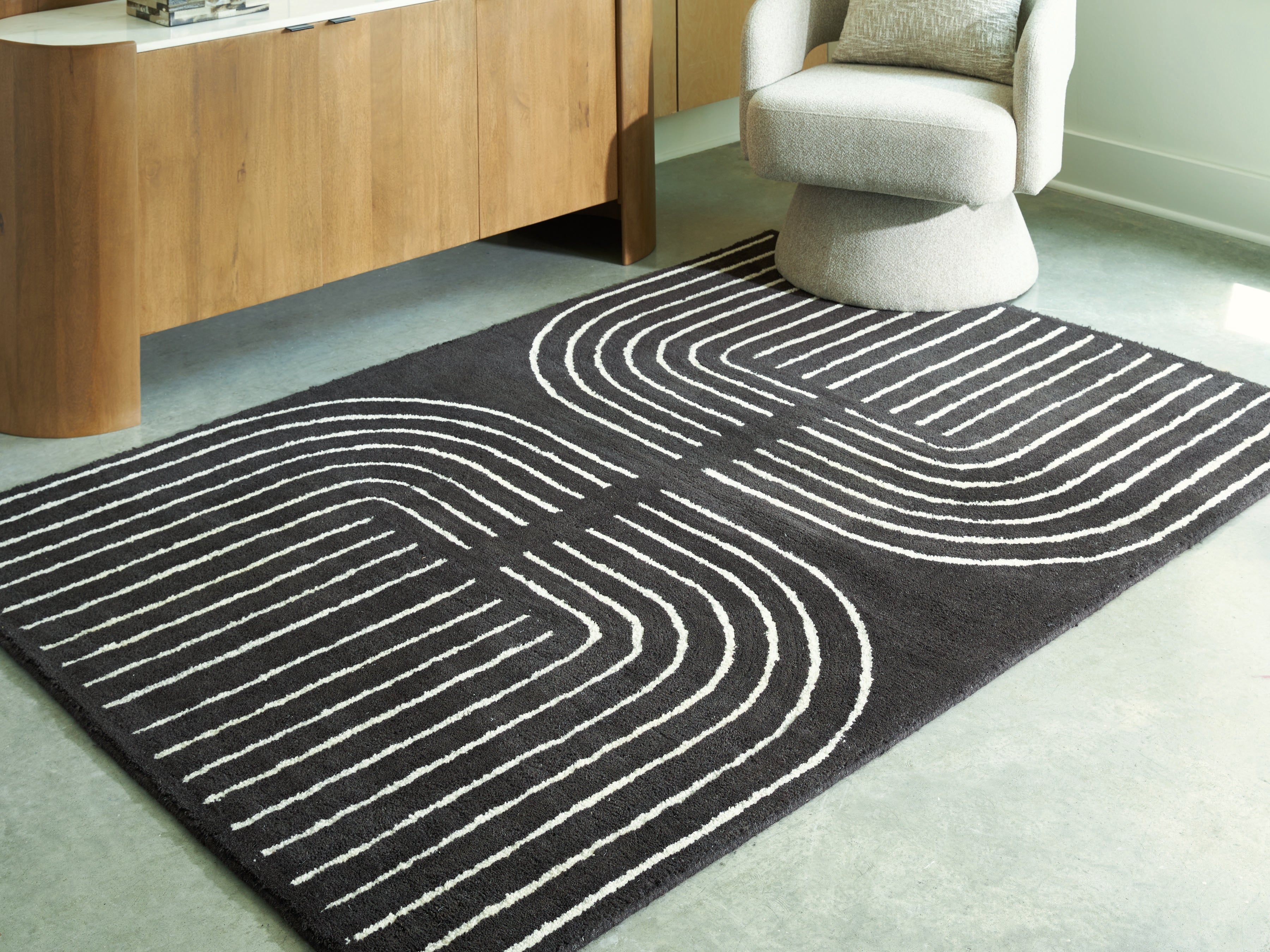 Warmstead Furniture - Ashley Furniture - Eldonmore Rug - 7'8" x 10' Area Rug / Black/Ivory - R407571