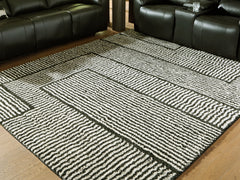 Warmstead Furniture - Ashley Furniture - Kurtmen Rug - 7'10" x 9'10" Area Rug / Black/Ivory - R407591