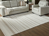Warmstead Furniture - Ashley Furniture - Gadence Rug - 7'8" x 10' Area Rug / Ivory/Tan - R407641