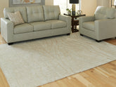 Warmstead Furniture - Ashley Furniture - Jaseena Rug - 7'8" x 10' Area Rug / Beige/Tan - R407721