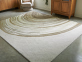 Warmstead Furniture - Ashley Furniture - Rizwana Rug - 7'6" x 10' Area Rug / Ivory/Brown/Gray - R407761