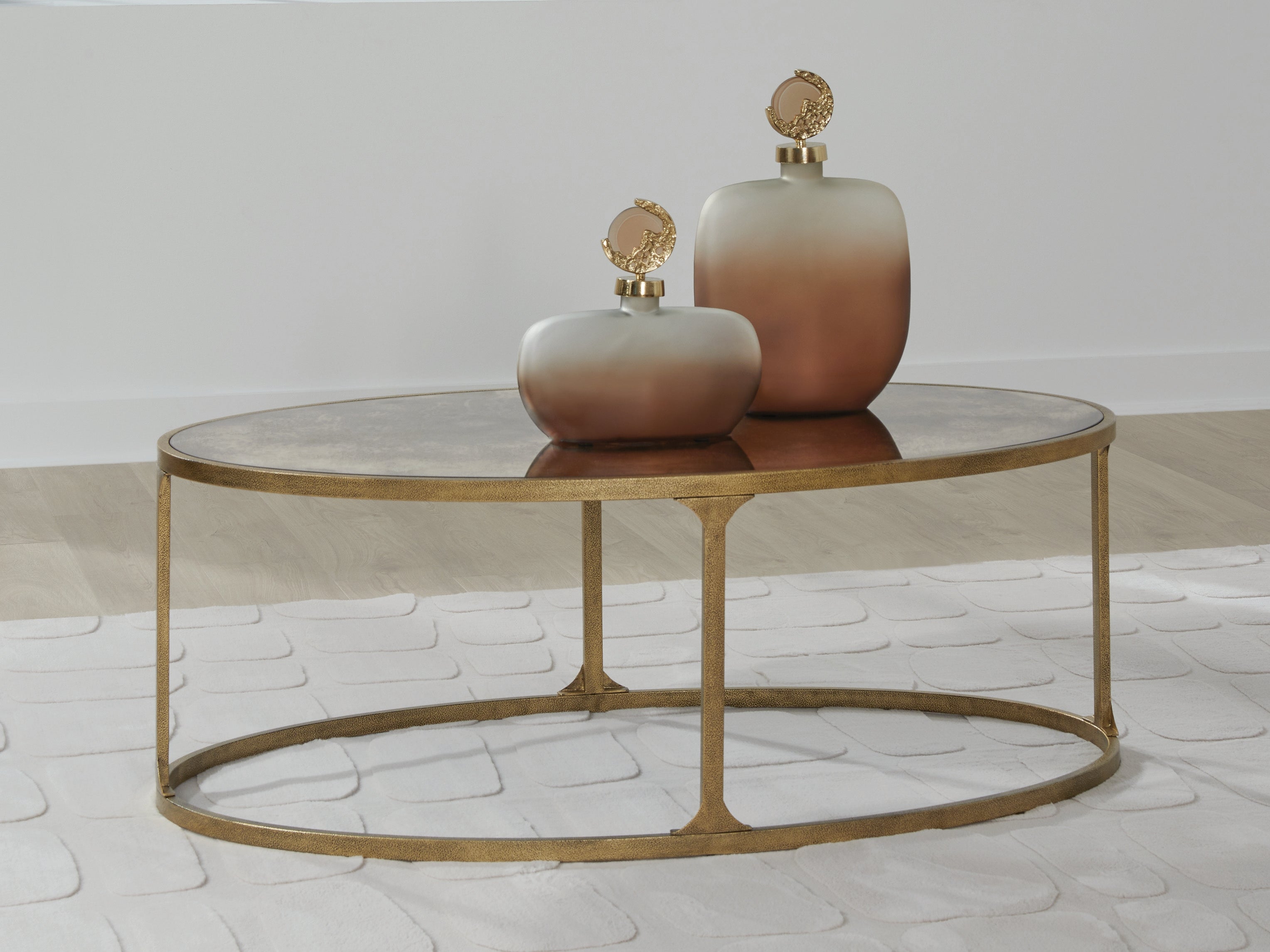 Warmstead Furniture - Ashley Furniture - Korajane Coffee Table - Oval Cocktail Table / Antique Gold - T399-0