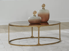 Warmstead Furniture - Ashley Furniture - Korajane Coffee Table - Oval Cocktail Table / Antique Gold - T399-0
