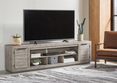 Warmstead Furniture - Ashley Furniture - Naydell 92" TV Stand - 92" / Gray - W996-78
