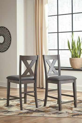 Warmstead Furniture - Ashley Furniture - Caitbrook Dining Room - Counter Height Upholstered Bar Stool (Set of 2) / Gray - D388-124X2