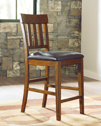Warmstead Furniture - Ashley Furniture - Ralene Dining Room - Counter Height Bar Stool (Set of 2) / Medium Brown - D594-124X2
