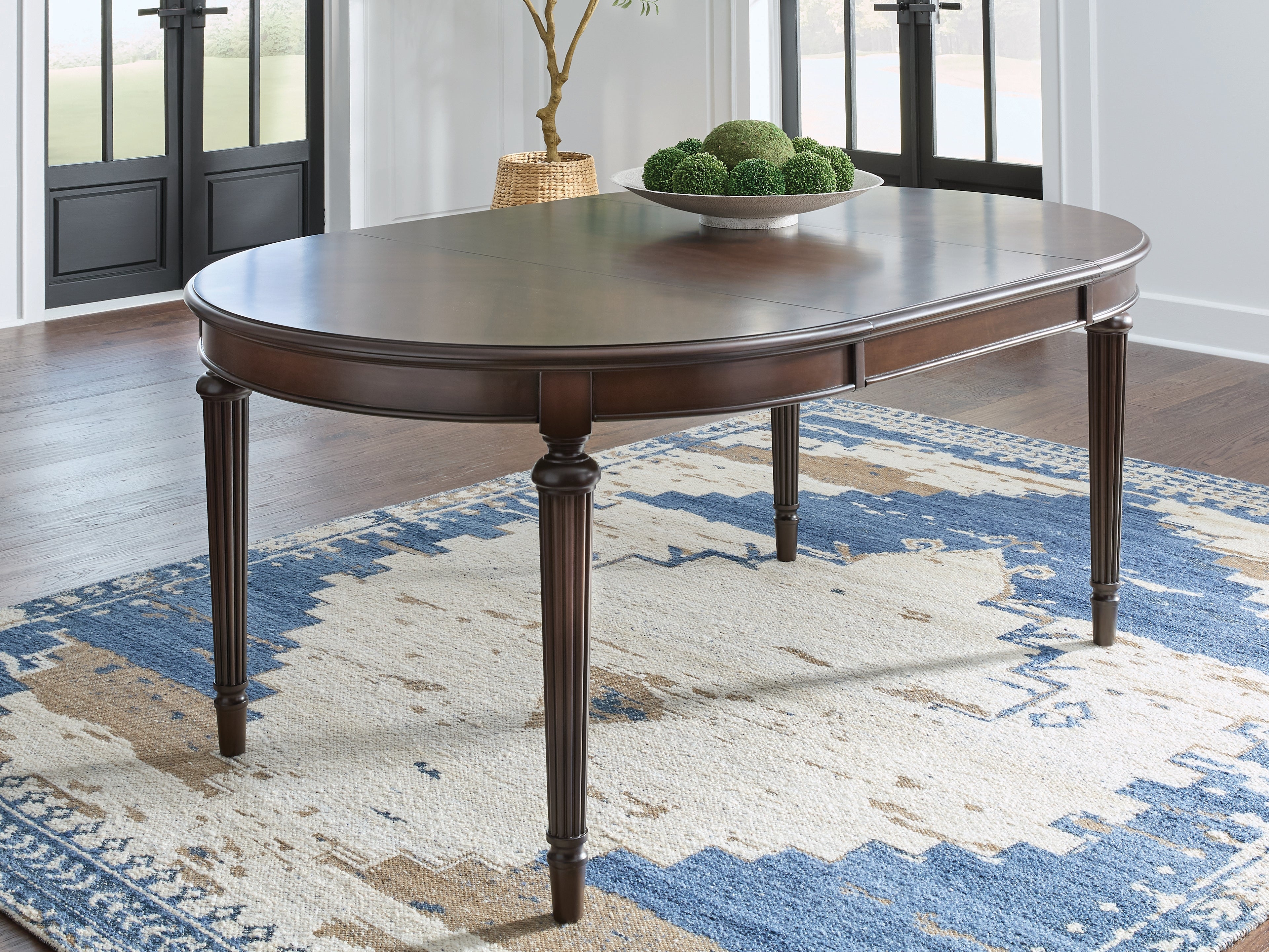 Warmstead Furniture - Ashley Furniture - Lavinton Dining Room - Oval Dining Room EXT Table / Brown - D764-35
