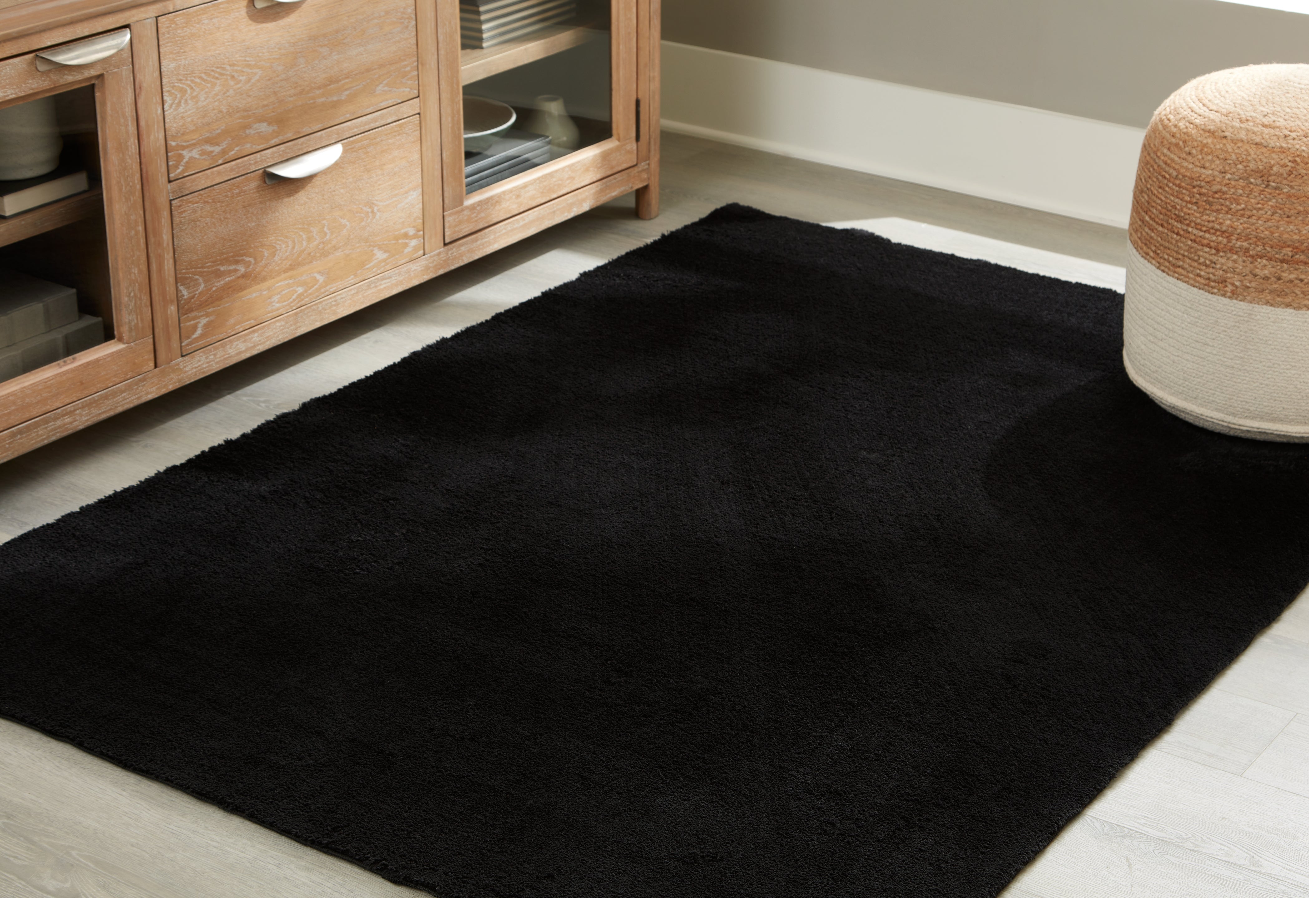Warmstead Furniture - Ashley Furniture - Anaben Rug - 8' x 10'1" Washable Rug / Black - R406311