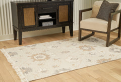 Warmstead Furniture - Ashley Furniture - Calkin Rug - 5' x 7' Rug / Linen/Gray/Caramel - R406392