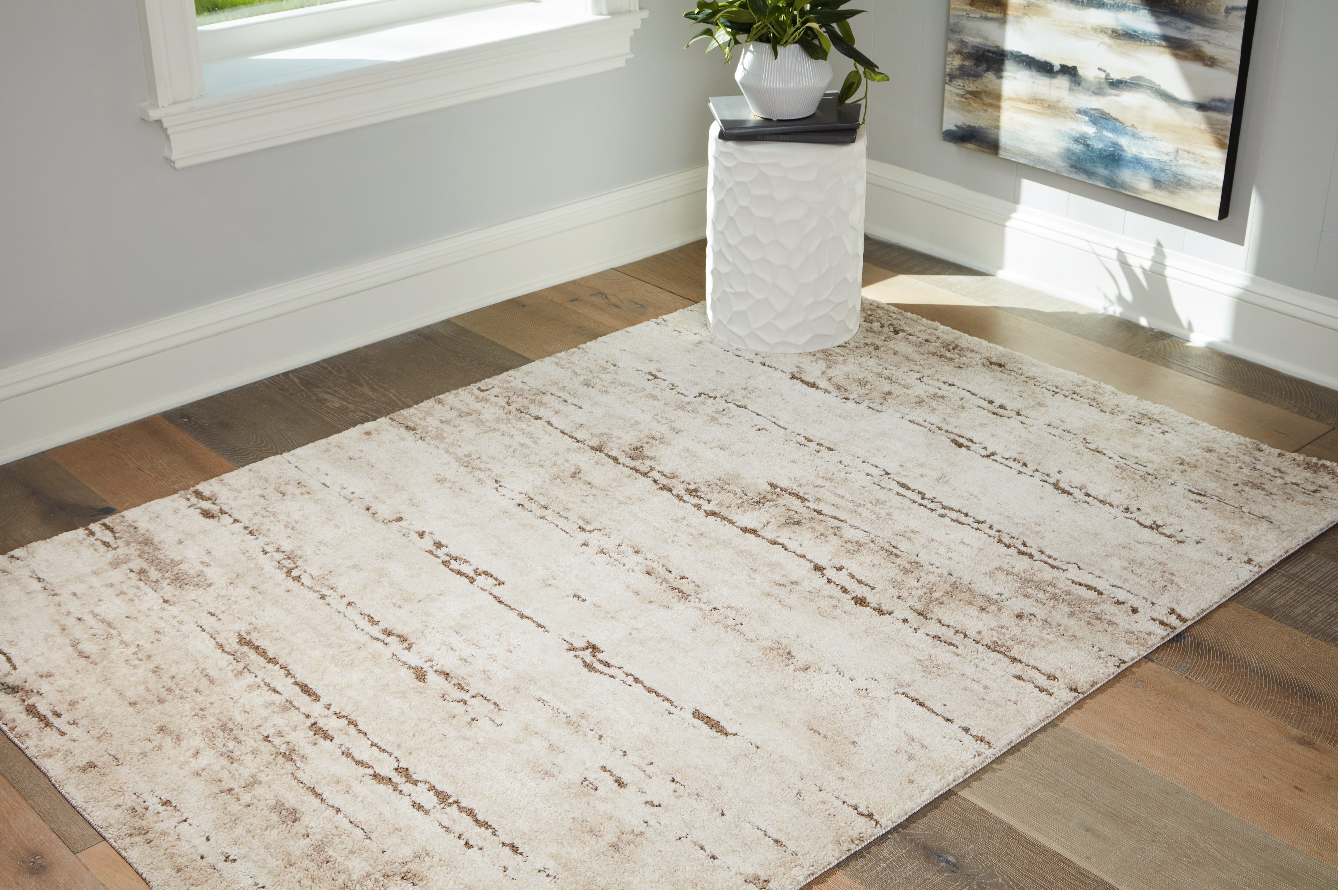 Warmstead Furniture - Ashley Furniture - Kasney Rug - 5' x 7' Rug / Cream/Brown - R406852
