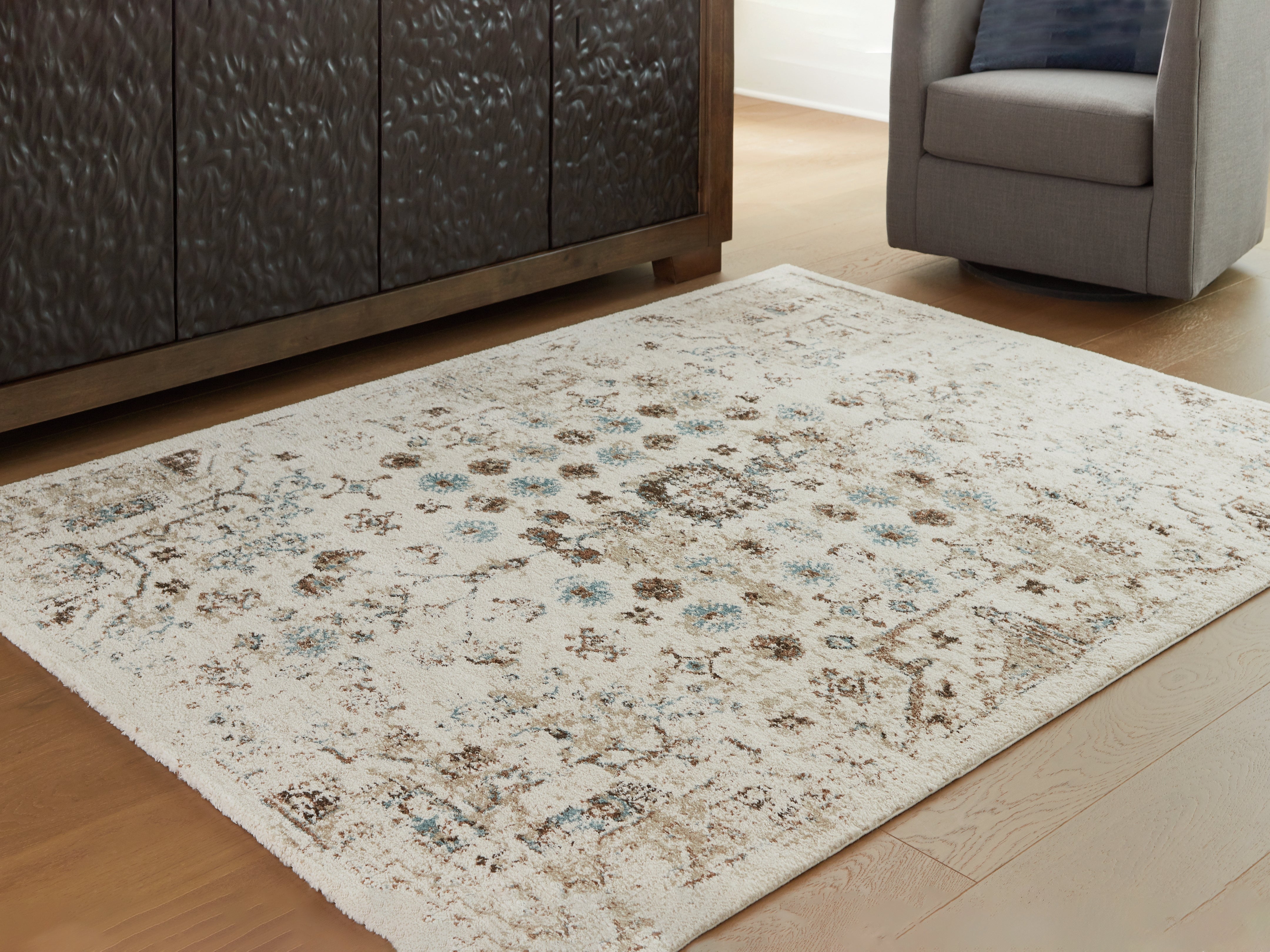 Warmstead Furniture - Ashley Furniture - Jossler Rug - 8' x 10' Rug / Ivory/Brown/Teal - R407071