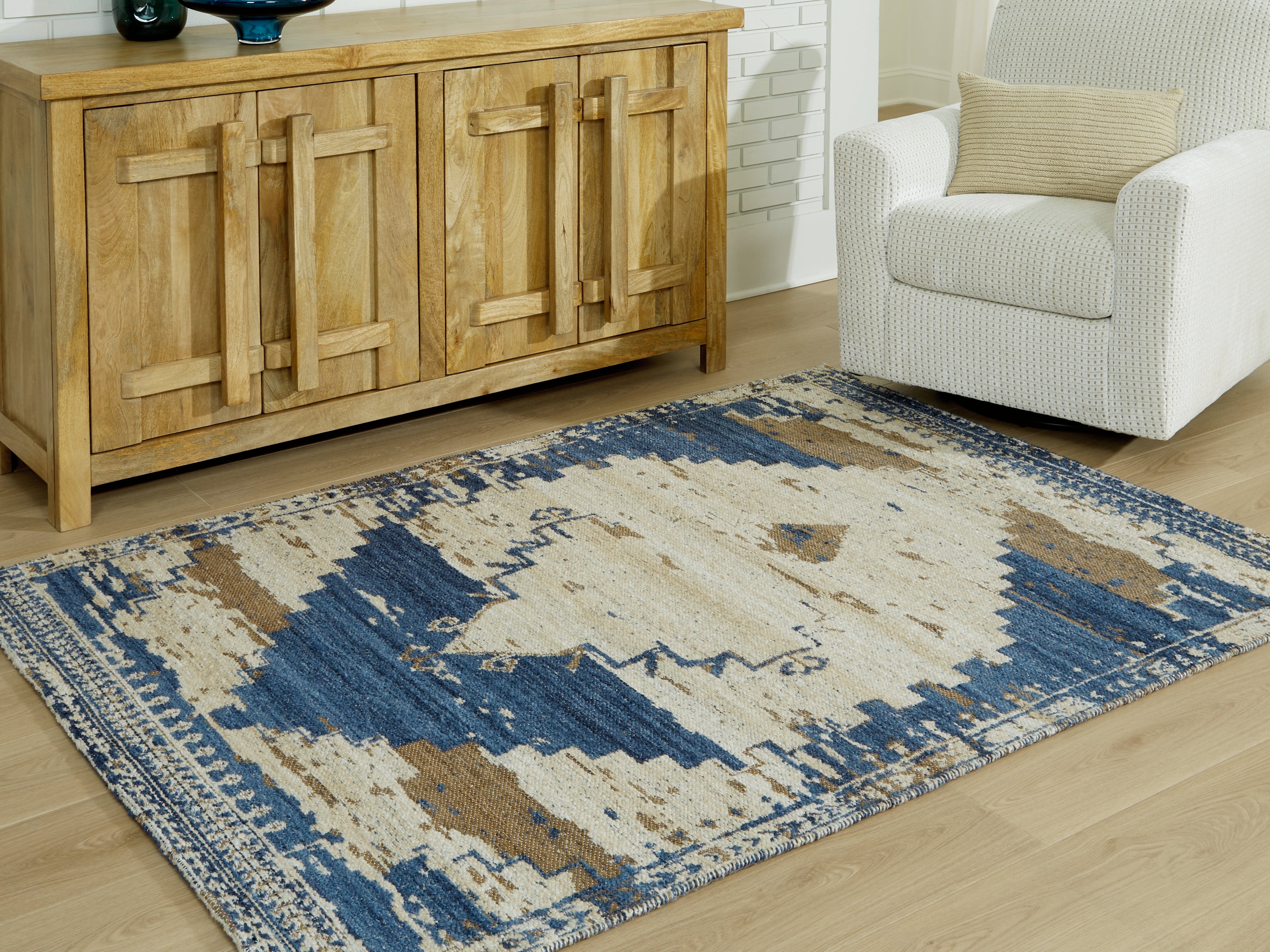 Warmstead Furniture - Ashley Furniture - Varnler Rug - 5' x 7' Rug / Blue/Brown/Tan - R407132