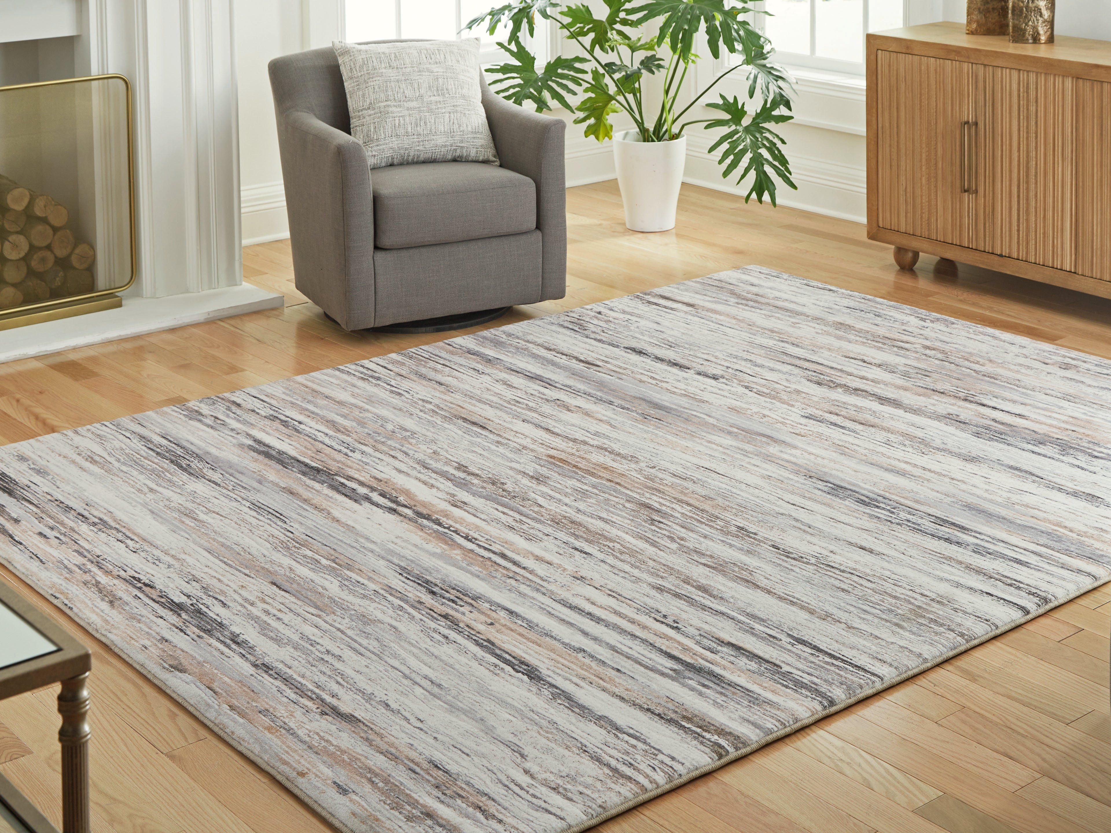 Warmstead Furniture - Ashley Furniture - Nace Rug - 7'6" x 9'6" Area Rug / Gray/Brown/White - R407471