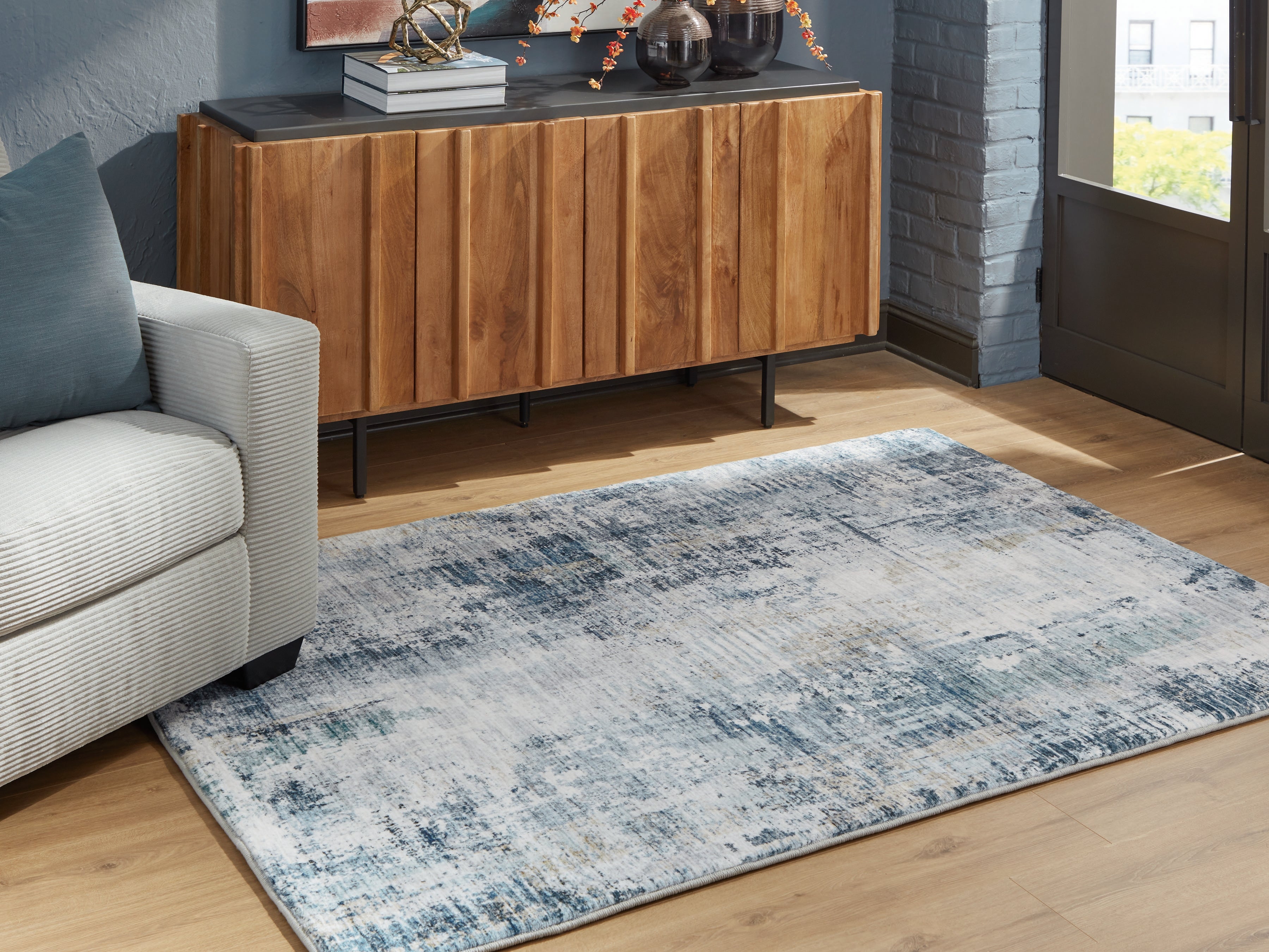 Warmstead Furniture - Ashley Furniture - Arlenmont Rug - 5' x 7' Area Rug / Blue/White/Brown - R407482