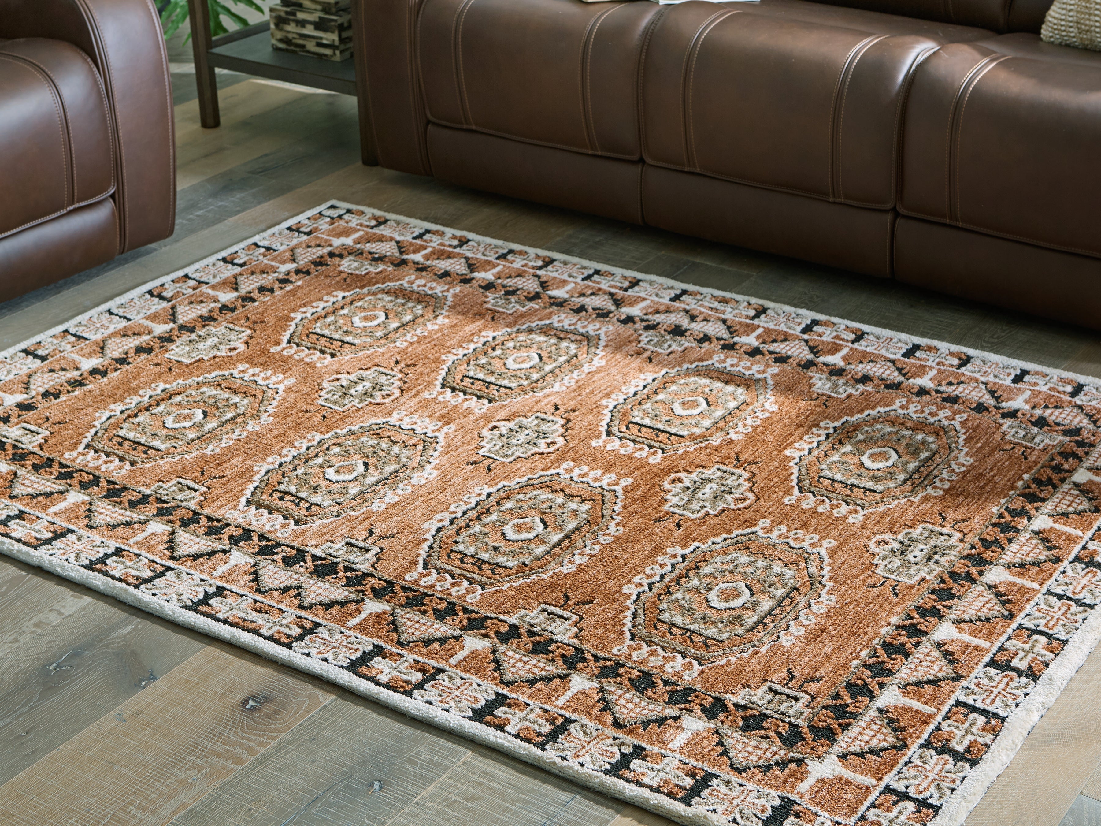 Warmstead Furniture - Ashley Furniture - Qaabiz Rug - 5' x 7' Area Rug / Sienna/Ivory/Black - R407522