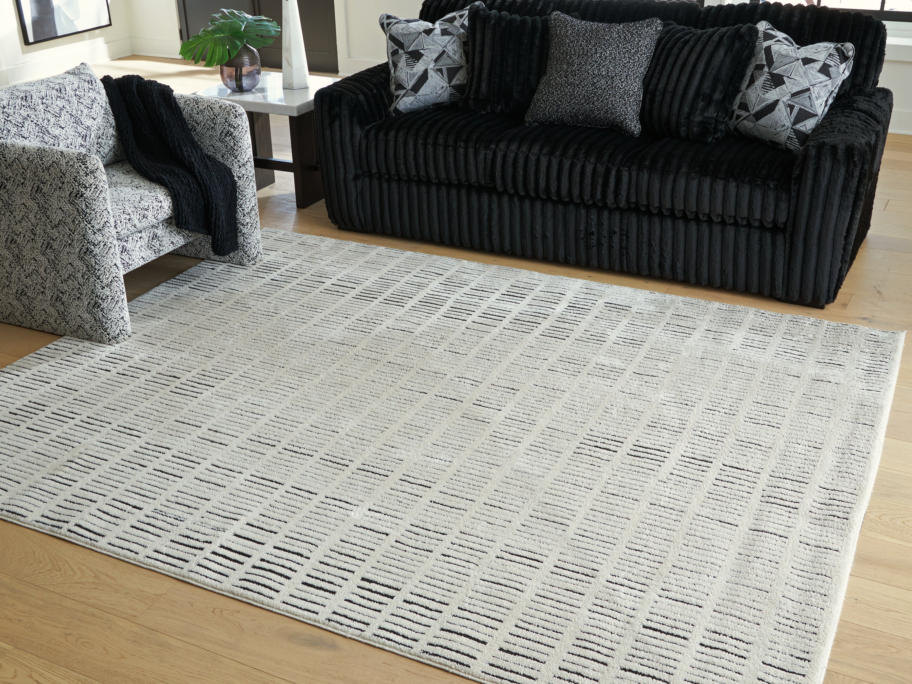 Warmstead Furniture - Ashley Furniture - Turinwith Rug - 7'10" x 9'10" Area Rug / Ivory/Black - R407551