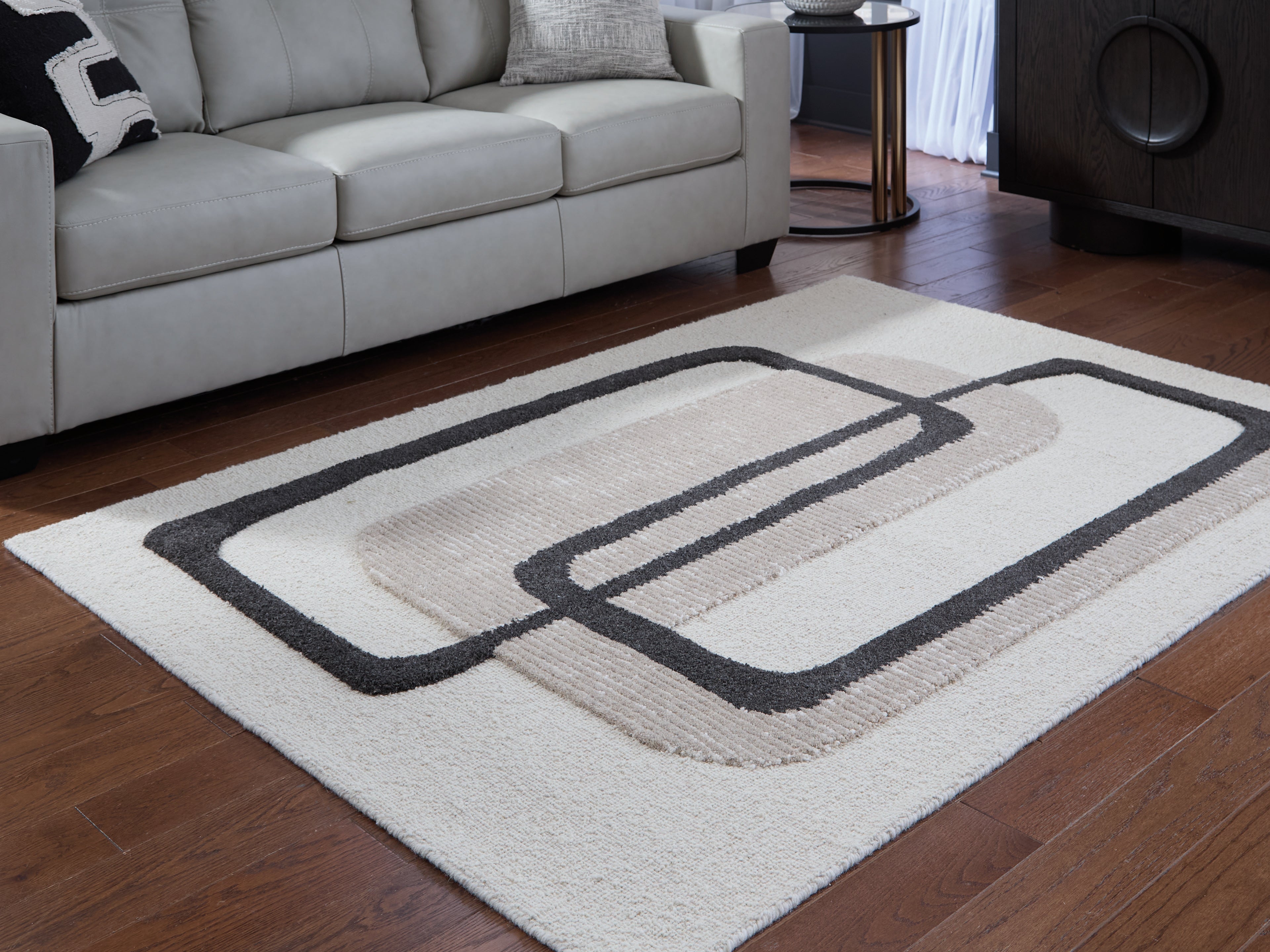 Warmstead Furniture - Ashley Furniture - Davismour Rug - 5' x 7' Area Rug / Ivory/Taupe/Charcoal - R407562