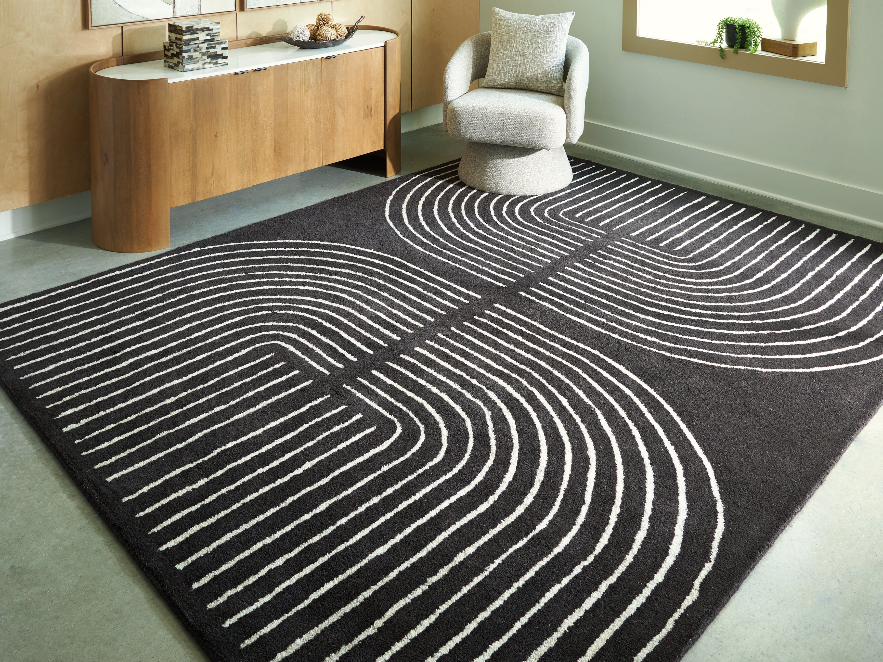 Warmstead Furniture - Ashley Furniture - Eldonmore Rug - 7'8" x 10' Area Rug / Black/Ivory - R407571