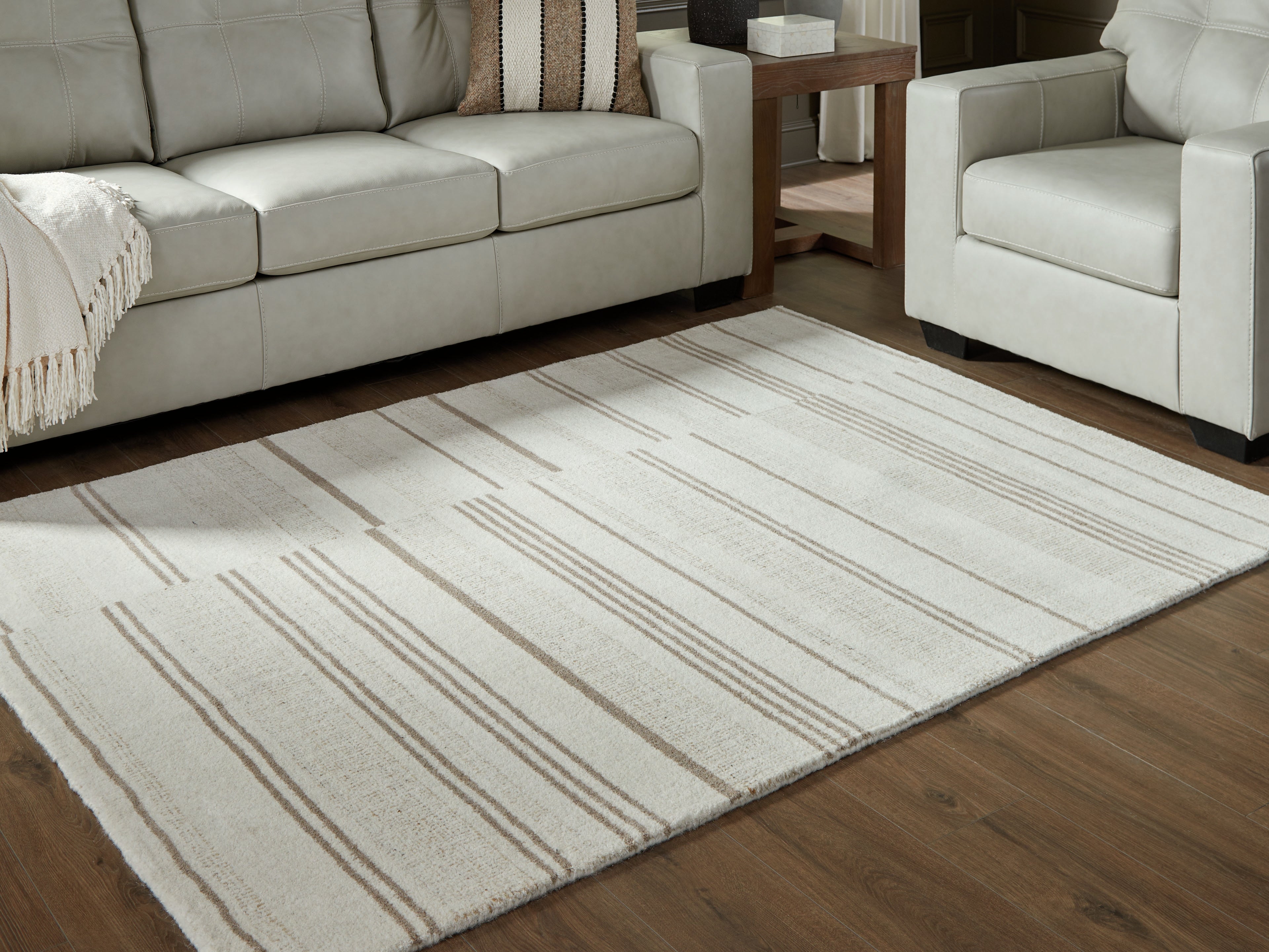 Warmstead Furniture - Ashley Furniture - Gadence Rug - 5' x 7' Area Rug / Ivory/Tan - R407642