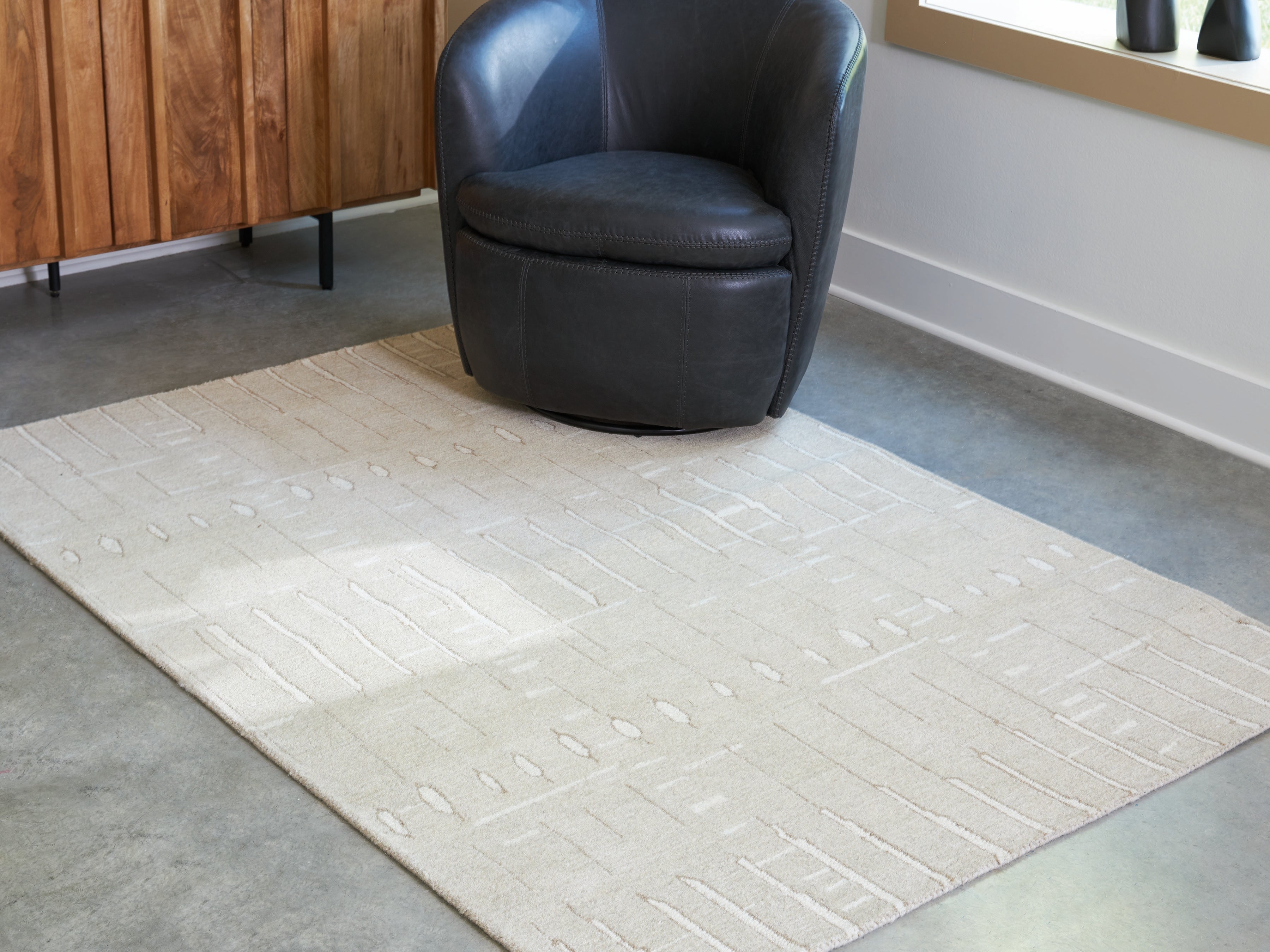 Warmstead Furniture - Ashley Furniture - Wolbert Rug - 5' x 7' Area Rug / Tan/Ivory - R407662