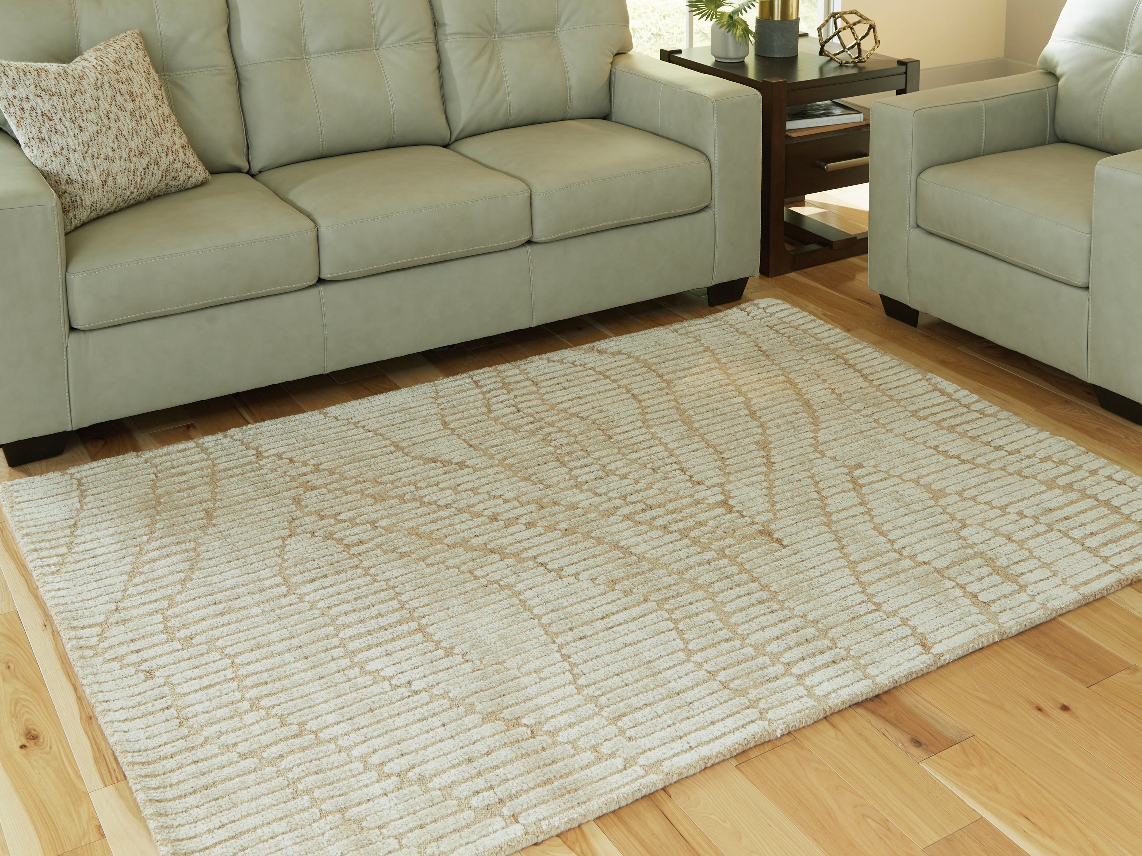 Warmstead Furniture - Ashley Furniture - Jaseena Rug - 5' x 7' Area Rug / Beige/Tan - R407722