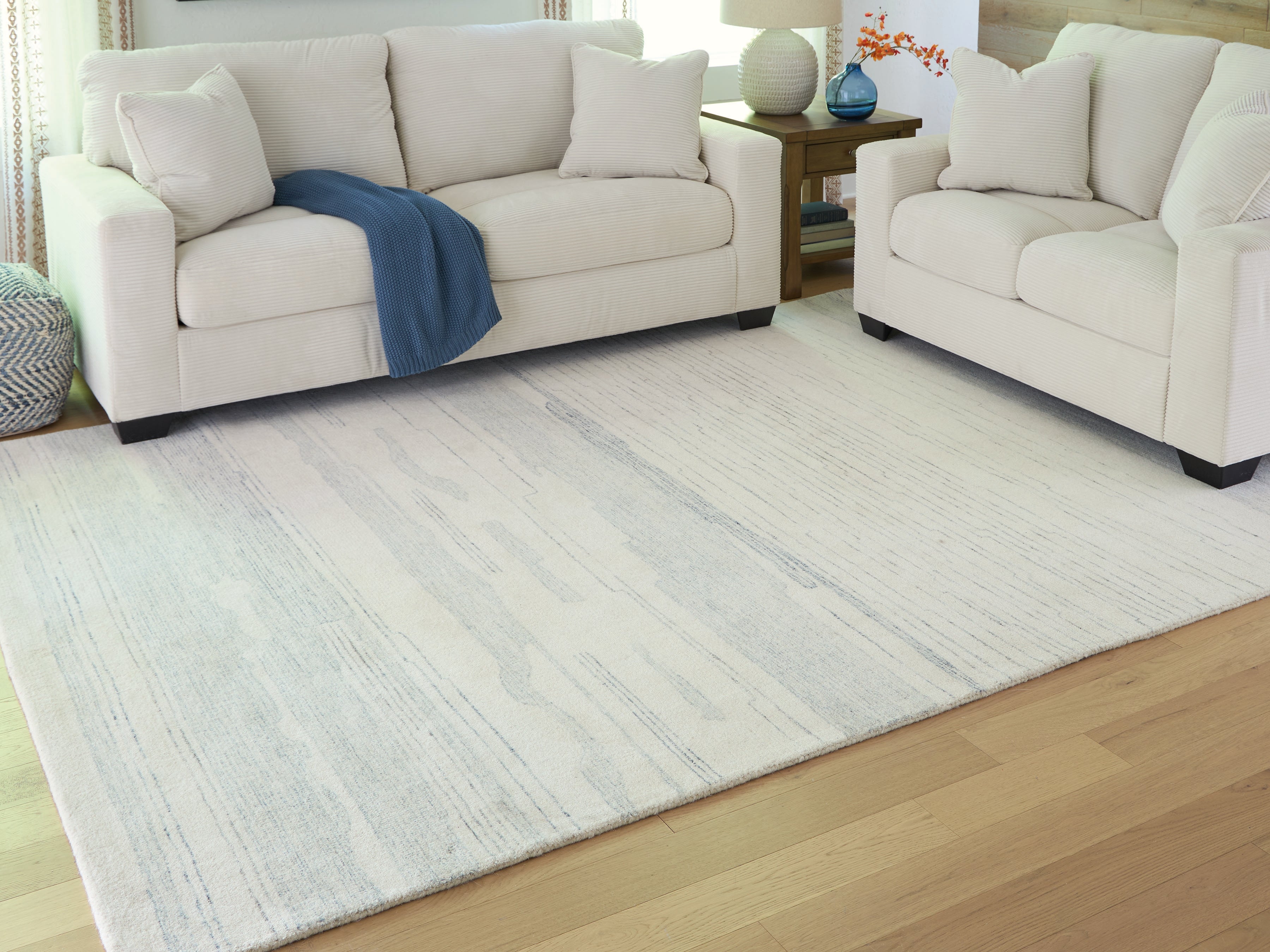 Warmstead Furniture - Ashley Furniture - Genemost Rug - 7'8" x 10' Area Rug / Ivory/Blue - R407841